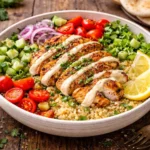healthy chicken shawarma quinoa bowl with grilled chicken fresh vegetables and tahini sauce
